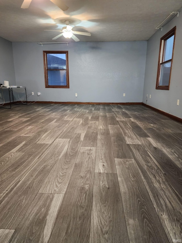 empty room featuring hardwood / wood-style floors and a healthy amount of sunlight