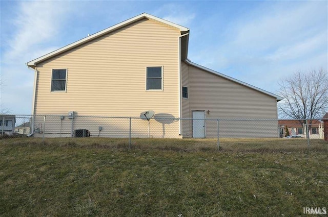 view of home's exterior with a yard