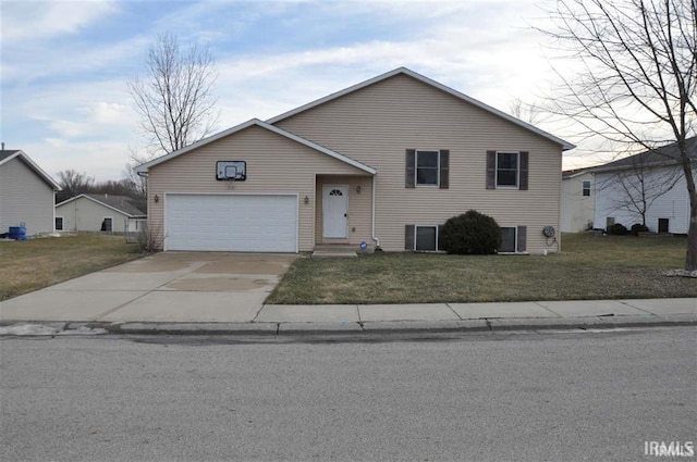 view of front of house featuring a garage and a front lawn