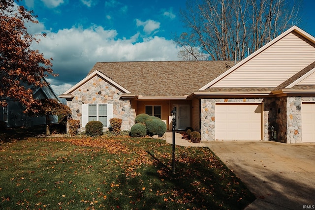 view of front of home with a front lawn and a garage