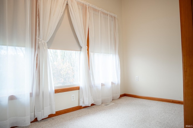 empty room featuring carpet floors