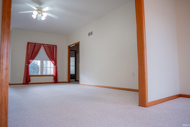 carpeted empty room with ceiling fan