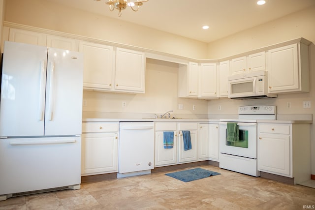 kitchen featuring white cabinets, white appliances, and sink