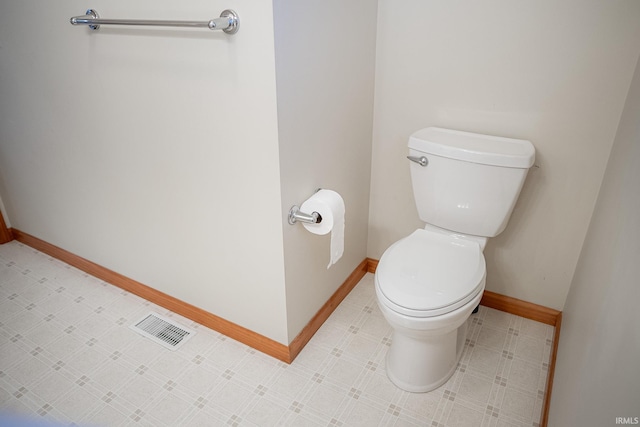 bathroom featuring toilet