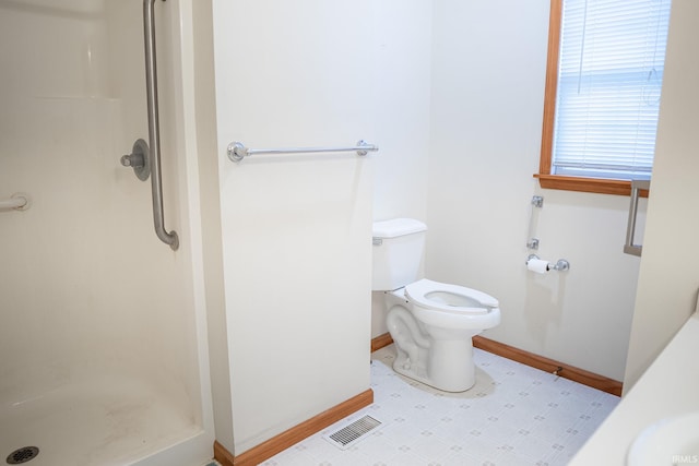 bathroom with sink, toilet, and a shower