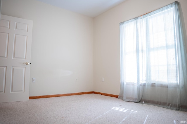 unfurnished room featuring carpet