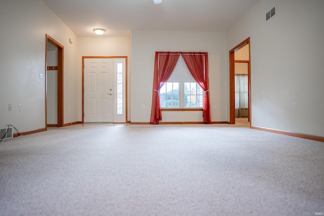 view of carpeted entrance foyer