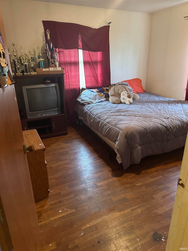 bedroom featuring dark hardwood / wood-style floors