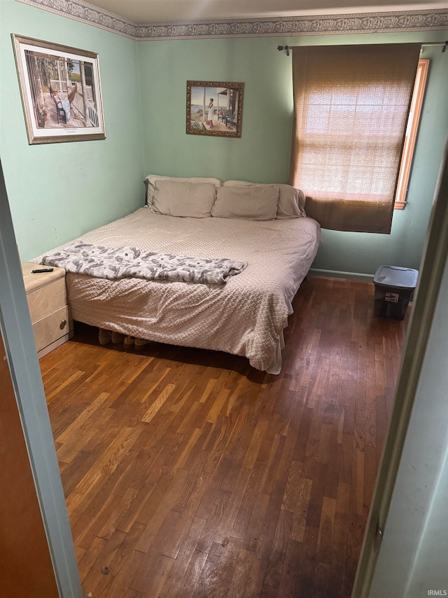 bedroom featuring dark hardwood / wood-style floors