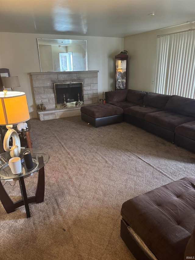 carpeted living room with a fireplace