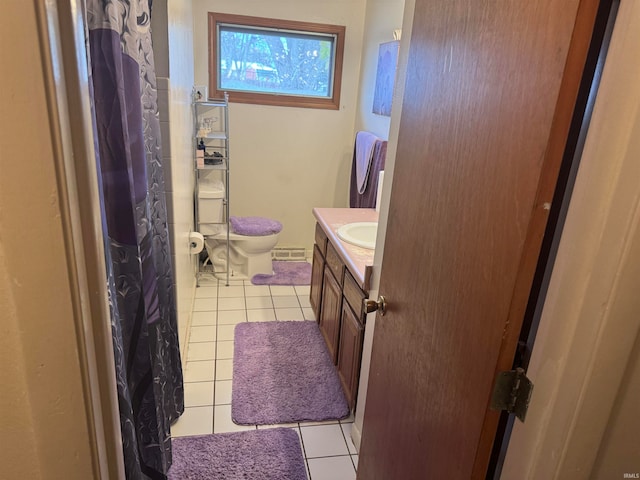 bathroom featuring toilet, vanity, and tile patterned floors