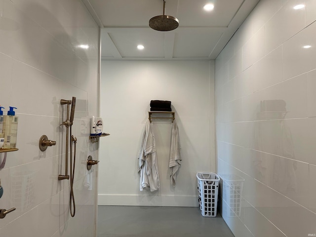 bathroom with concrete flooring and a shower