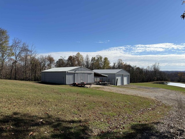 3536 Ridge Rd, Williams, IN 47470 - view of pole building featuring a lawn and a water view