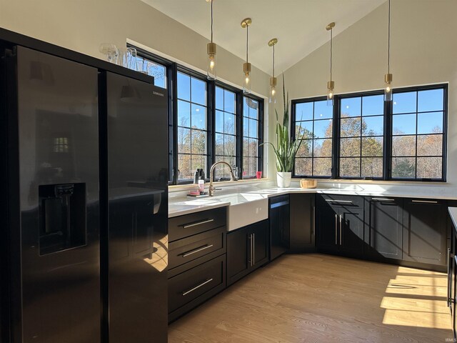 3536 Ridge Rd, Williams, IN 47470 - kitchen with black appliances, a sink, light countertops, light wood-style floors, and dark cabinets
