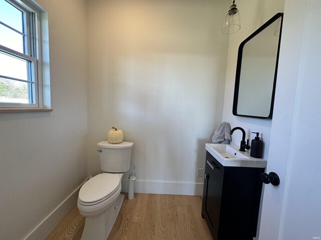 3536 Ridge Rd, Williams, IN 47470 - bathroom featuring wood finished floors, toilet, baseboards, and vanity