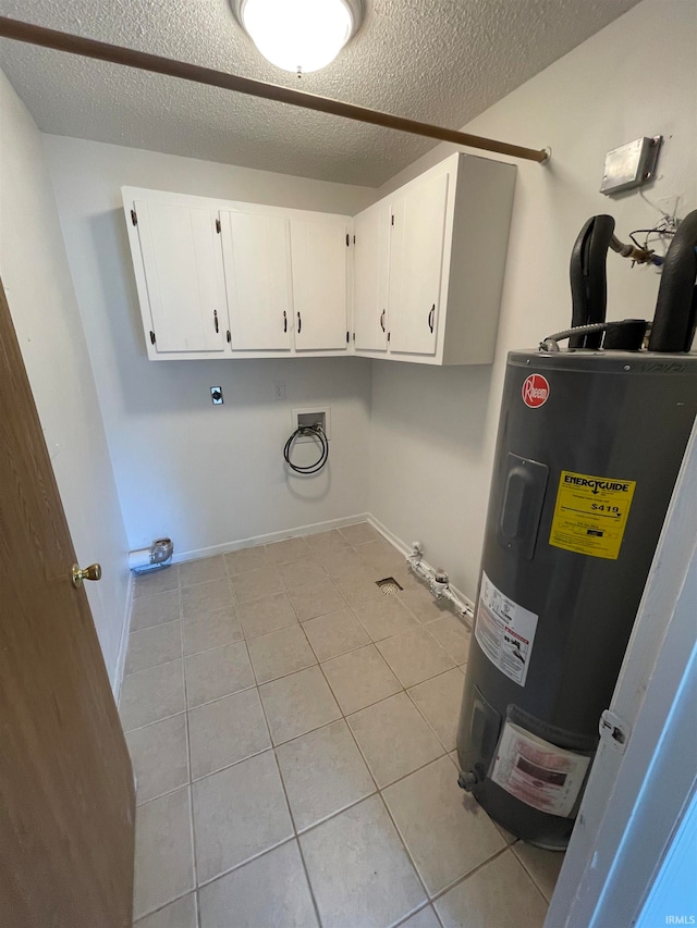 laundry room with cabinets, washer hookup, a textured ceiling, and water heater