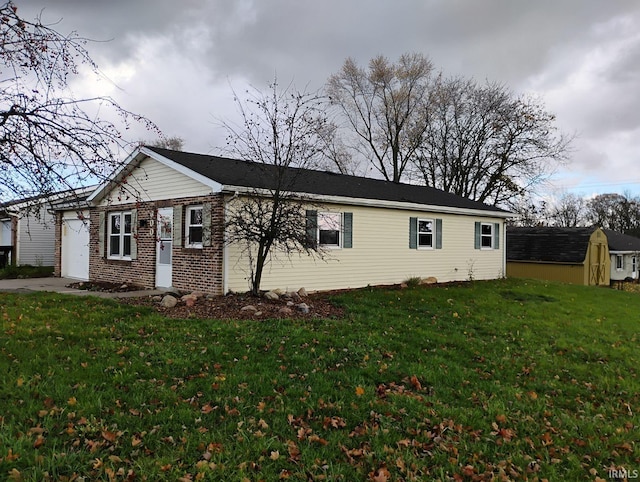 view of home's exterior featuring a garage and a lawn