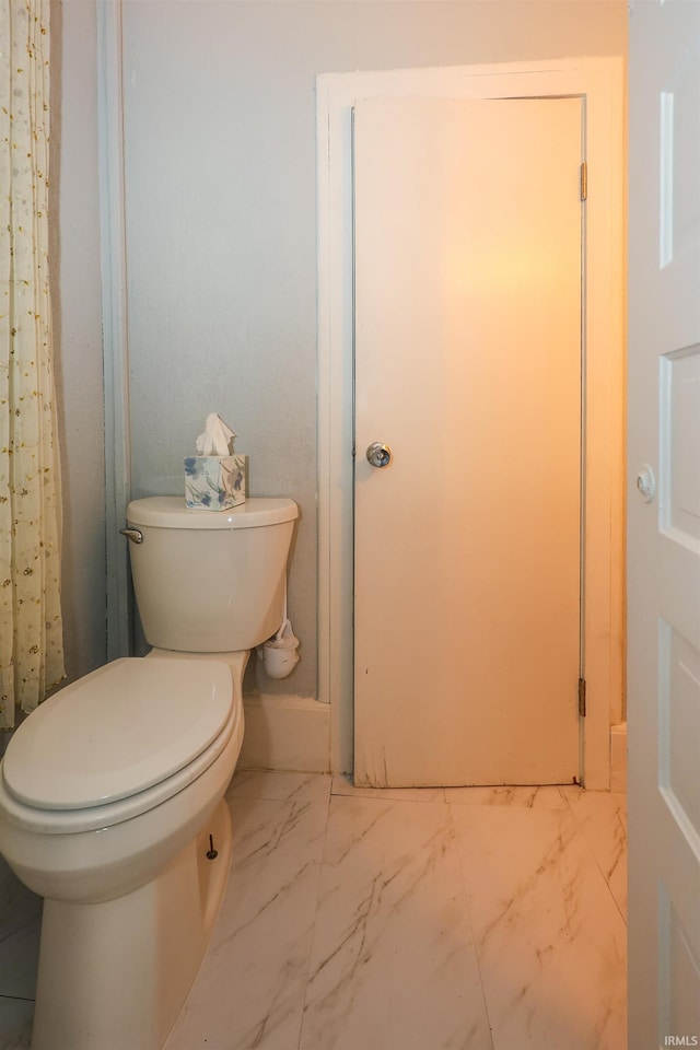 bathroom featuring toilet