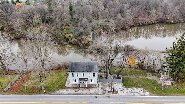 birds eye view of property with a water view