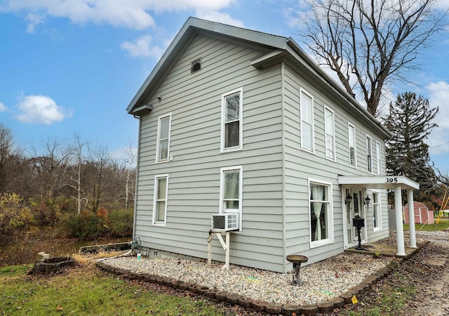 view of side of home with cooling unit