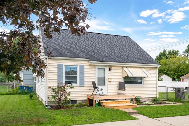 bungalow-style home featuring a front yard