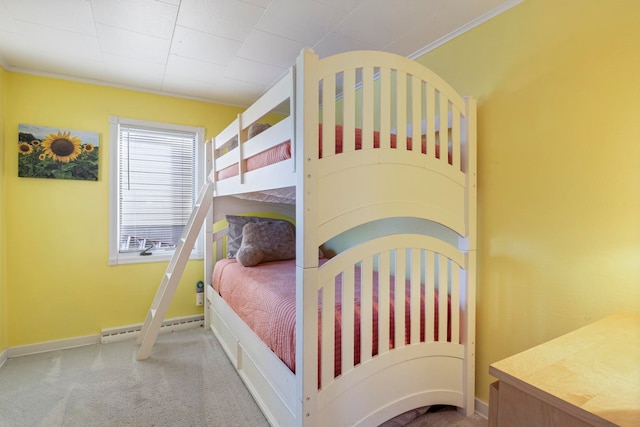 bedroom with carpet flooring, baseboard heating, and crown molding