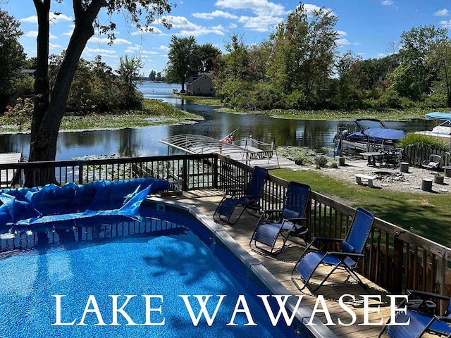 view of swimming pool with a water view