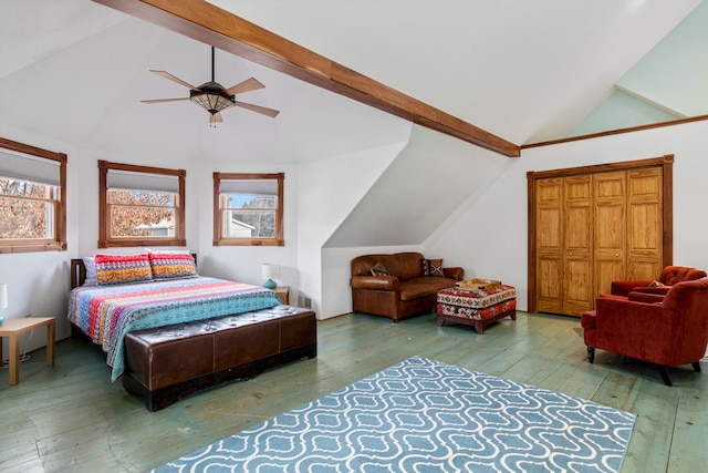 bedroom featuring ceiling fan, wood-type flooring, high vaulted ceiling, beamed ceiling, and a closet