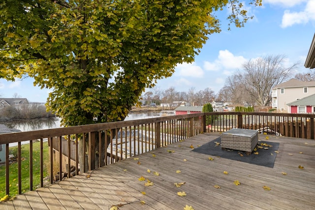 deck featuring a water view