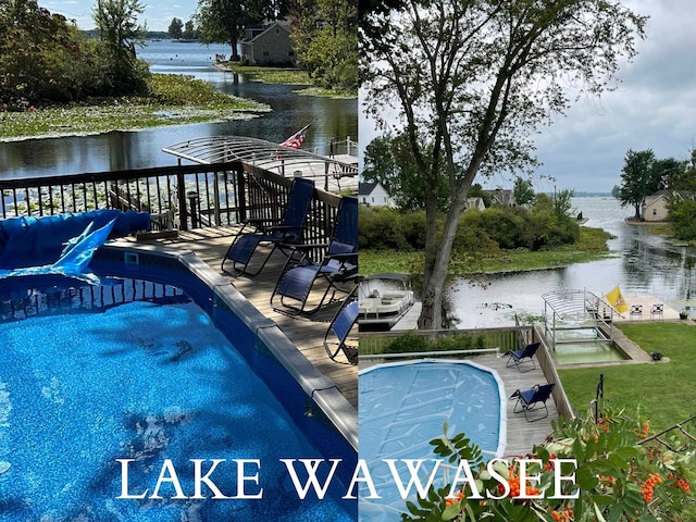 view of swimming pool featuring a water view