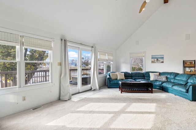 sunroom / solarium featuring ceiling fan and vaulted ceiling