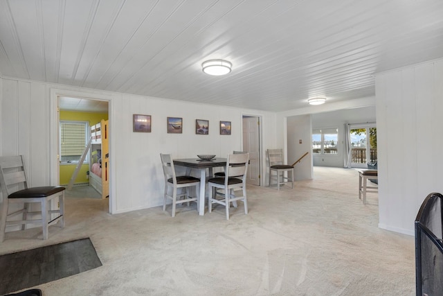 dining room featuring light colored carpet