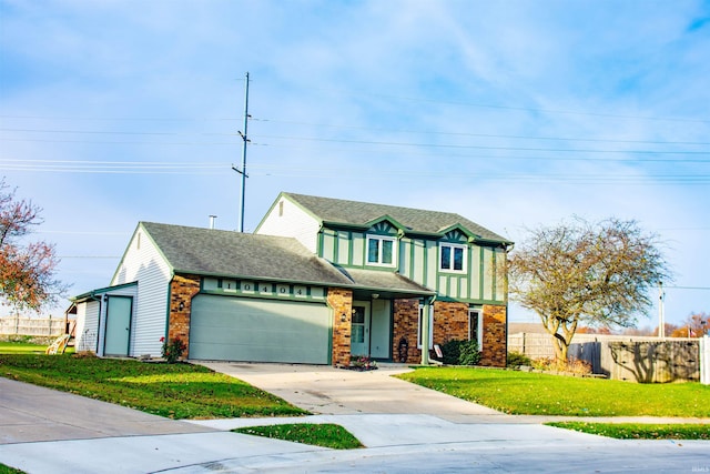 view of front of home featuring a front yard and a garage