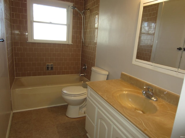 full bathroom with vanity, tiled shower / bath combo, and toilet