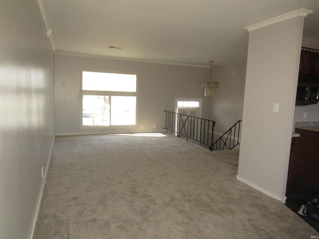 unfurnished room featuring carpet floors and ornamental molding