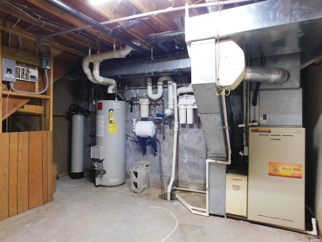 utility room featuring electric panel and water heater