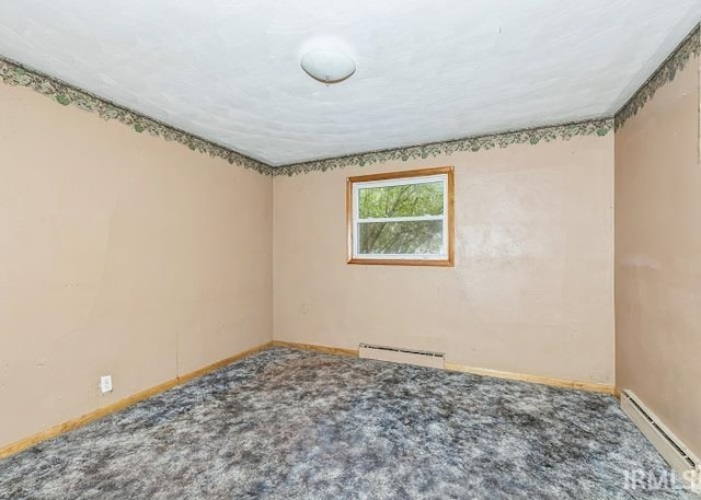 empty room with baseboard heating and carpet flooring