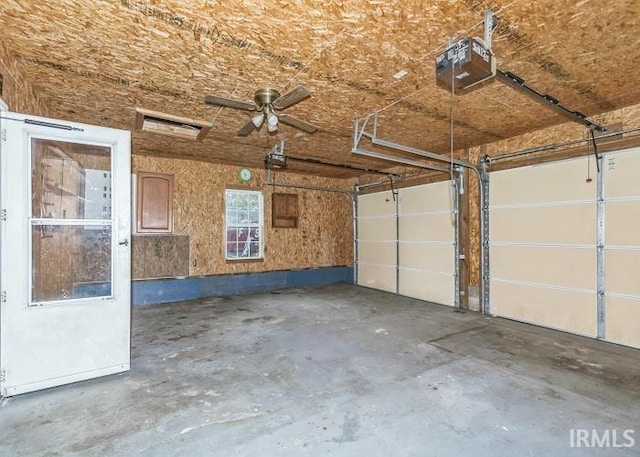 garage featuring ceiling fan and a garage door opener