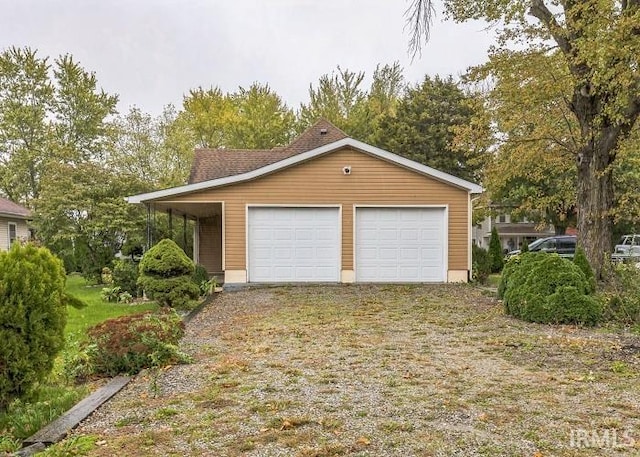 garage featuring a carport