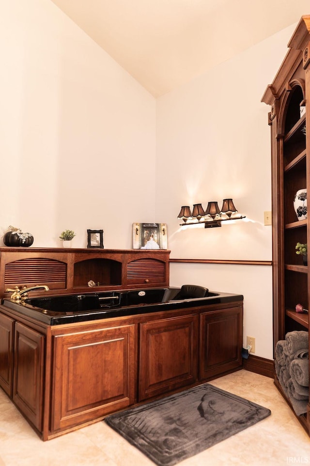 home office featuring vaulted ceiling