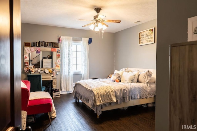 bedroom featuring ceiling fan and dark hardwood / wood-style flooring