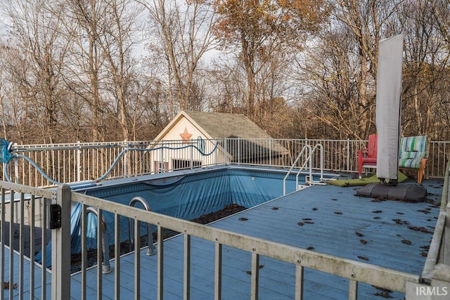 view of swimming pool featuring a deck