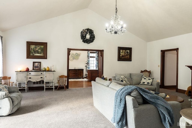 carpeted living room featuring an inviting chandelier and vaulted ceiling