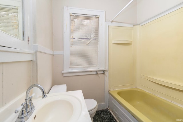 full bathroom with shower / tub combination, sink, and toilet