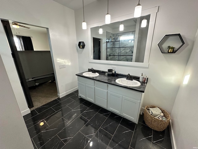 bathroom with vanity, ceiling fan, and a tile shower