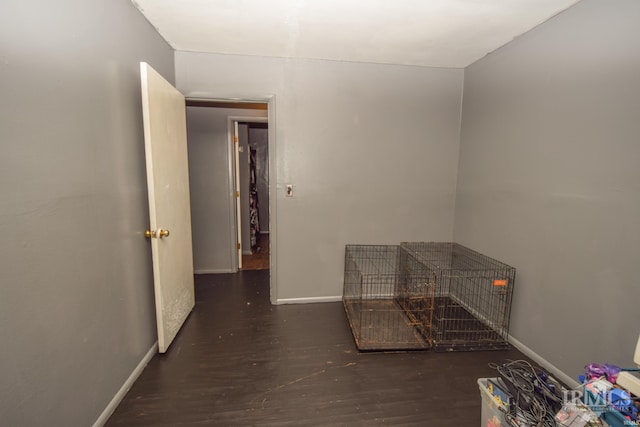 corridor featuring dark hardwood / wood-style floors