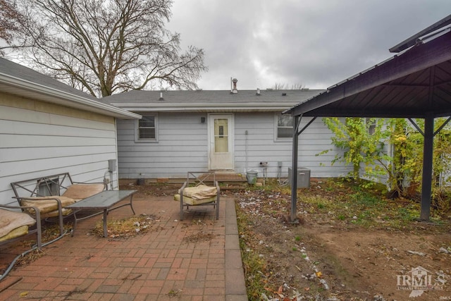 back of property with a patio