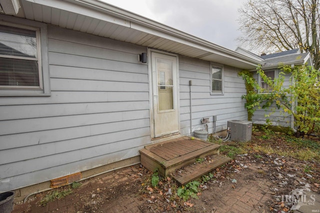 doorway to property with central AC