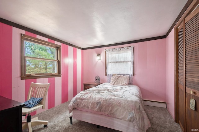 bedroom with carpet, ornamental molding, and a baseboard heating unit