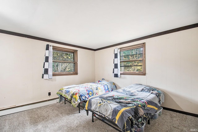 bedroom with carpet flooring, baseboard heating, and ornamental molding